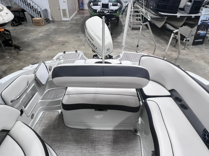 Slide: The Image of 2020 Crownline Eclipse E225 XS boat interior with white seating and modern design. - 18
