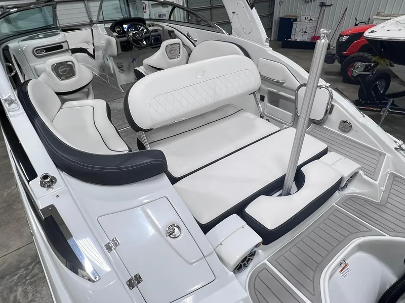 Slide: The Image of 2020 Crownline Eclipse E225 XS boat interior with white seating and modern dashboard. - 19