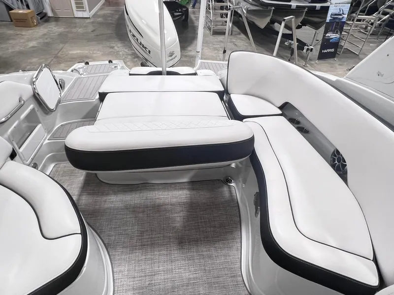 Slide: The Image of 2020 Crownline Eclipse E225 XS boat interior with white seating and modern design. - 20