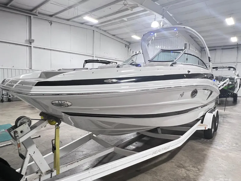 Slide: The Image of 2020 Crownline Eclipse E225 XS boat on trailer in indoor storage facility. - 3