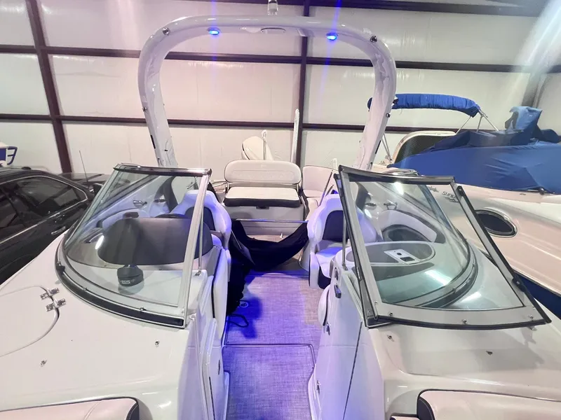 Slide: The Image of 2020 Crownline Eclipse E225 XS boat interior with open windshield and seating. - 37