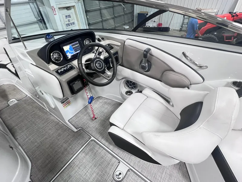 Slide: The Image of Interior of 2020 Crownline Eclipse E225 XS boat with modern dashboard and steering wheel. - 39