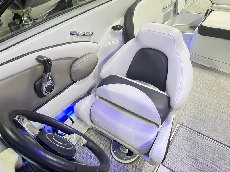 Slide: The Image of 2020 Crownline Eclipse E225 XS boat interior with steering wheel and captain's seat. - 43