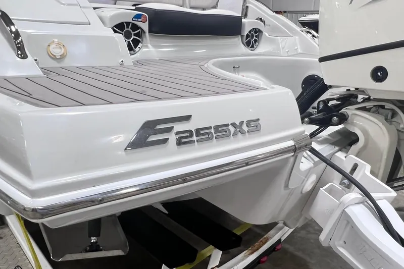 Slide: The Image of 2020 Crownline E225 XS boat rear view with sleek design and modern features. - 5