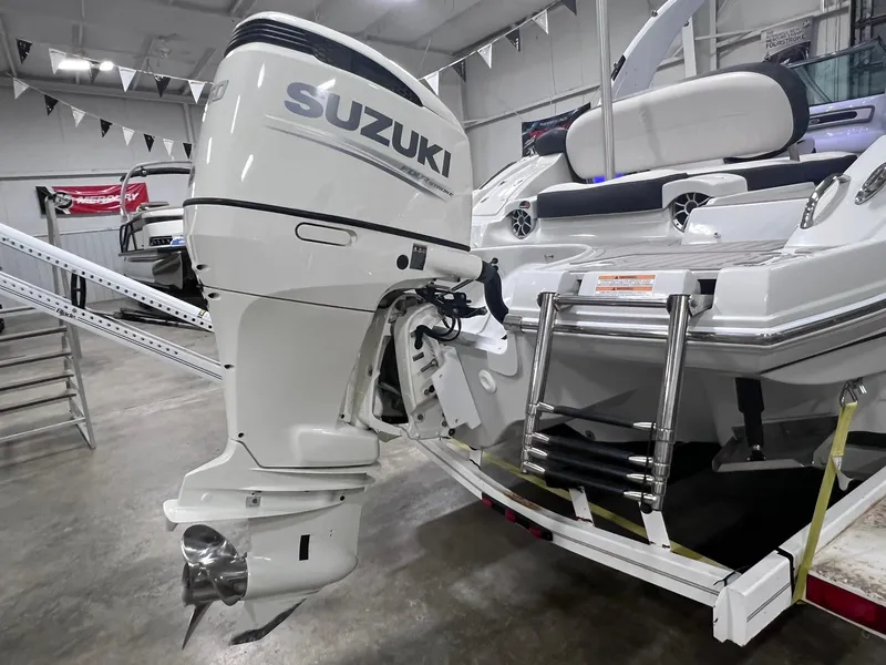 Slide: The Image of 2020 Crownline Eclipse E225 XS with Suzuki outboard motor in showroom. - 8