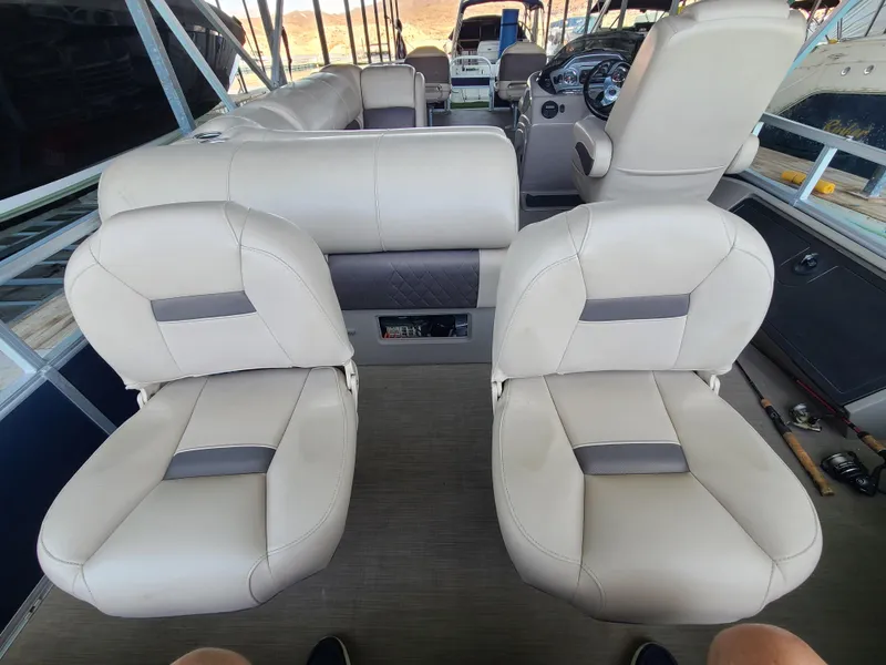 Slide: The Image of Interior of a 2021 Sun Tracker 22 Fishin Barge with beige seating. - 13