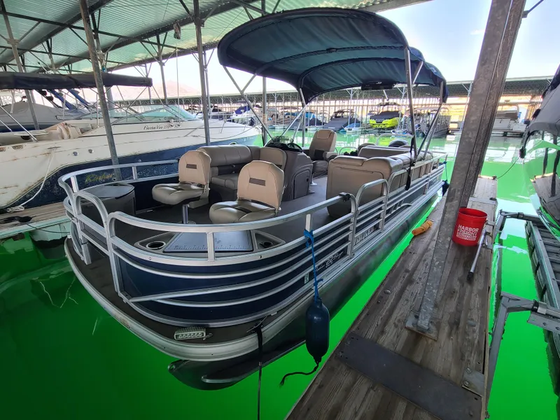 Slide: The Image of 2021 Sun Tracker 22 Fishin Barge pontoon boat docked in a marina. - 3