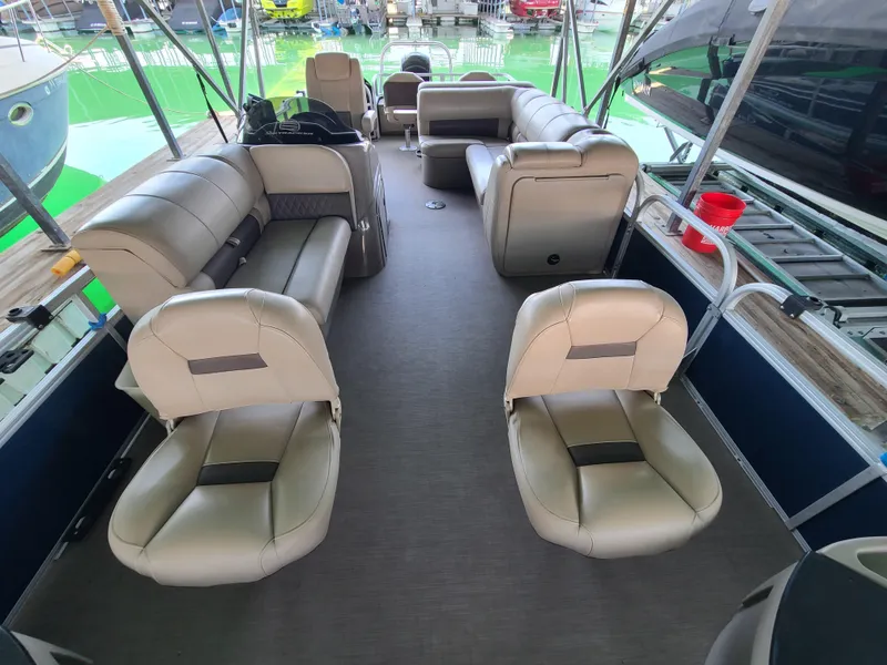 Slide: The Image of 2021 Sun Tracker 22 Fishin Barge interior with spacious seating and modern design. - 7