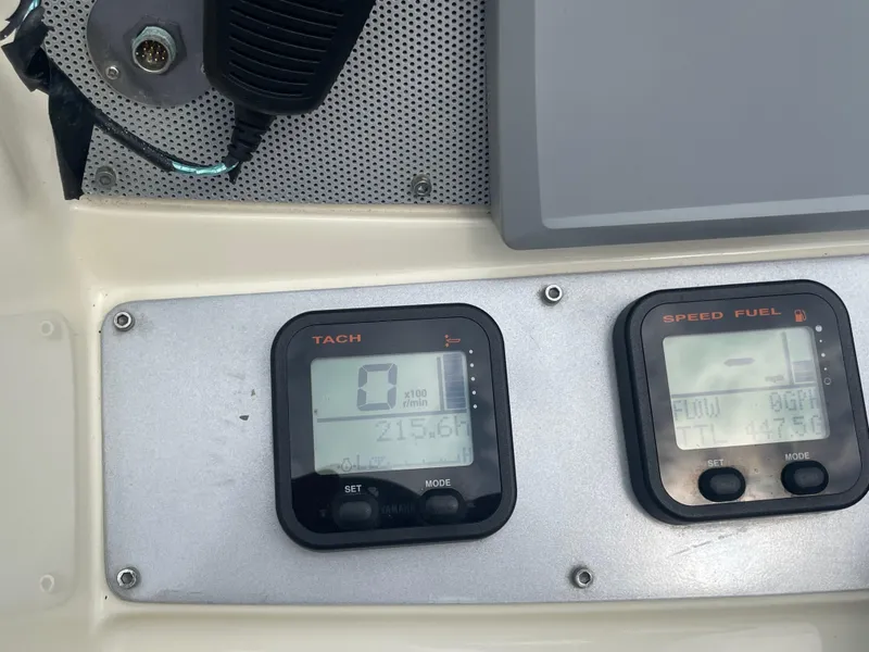 Slide: The Image of Dashboard of a 2015 Chris-Craft Catalina 23 showing tachometer and speed fuel gauges. - 17