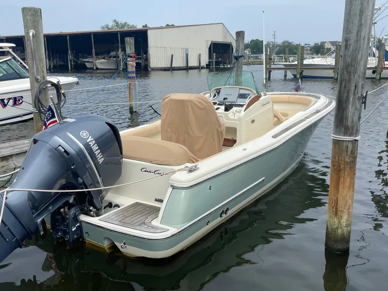 Slide: The Image of 2015 Chris-Craft Catalina 23 boat docked with Yamaha outboard motor. - 2