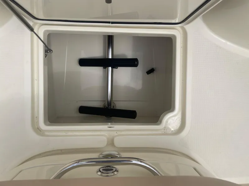 Slide: The Image of Open storage compartment on 2015 Chris-Craft Catalina 23 boat. - 22