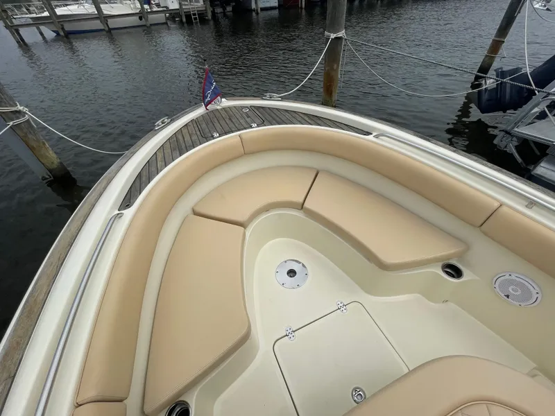 Slide: The Image of 2015 Chris-Craft Catalina 23 boat with beige seating, docked at marina. - 24