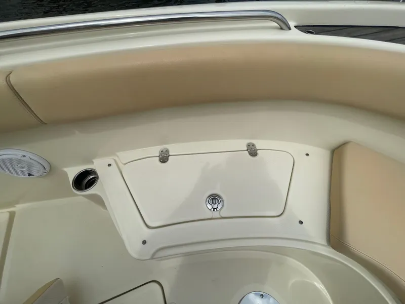 Slide: The Image of 2015 Chris-Craft Catalina 23 boat interior with storage compartment and speaker. - 25