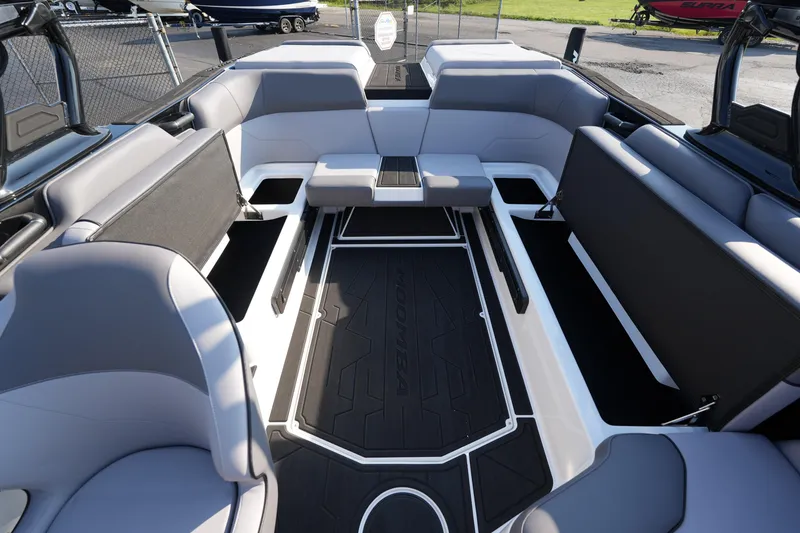 Slide: The Image of 2025 Moomba Max boat interior with spacious seating and sleek design. - 12