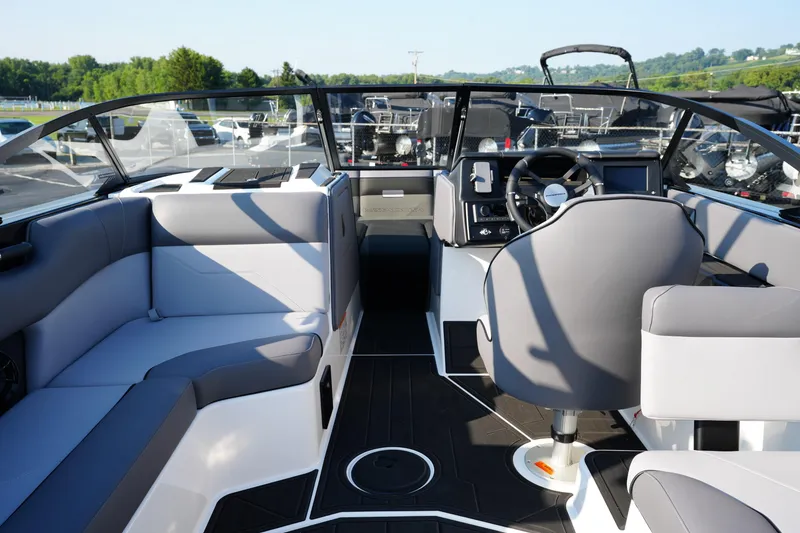 Slide: The Image of 2025 Moomba Max boat interior with modern seating and steering wheel. - 7
