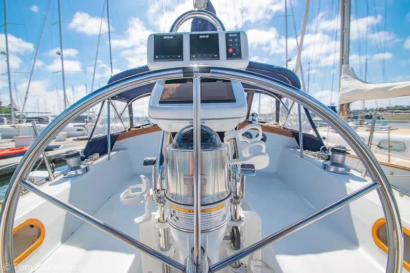 Slide: The Image of Cockpit of a 1987 Catalina 36 sailboat with steering wheel and navigation equipment. - 31
