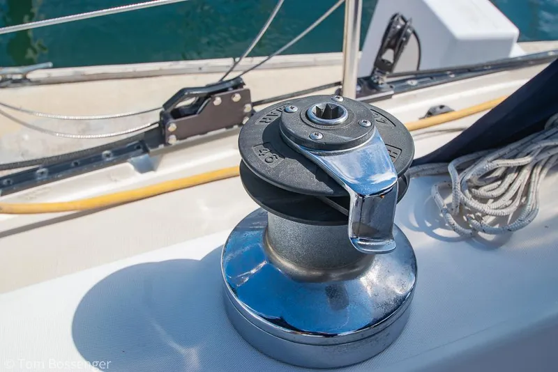 Slide: The Image of Winch on 1987 Catalina 36 sailboat deck, with ropes and railing visible. - 37