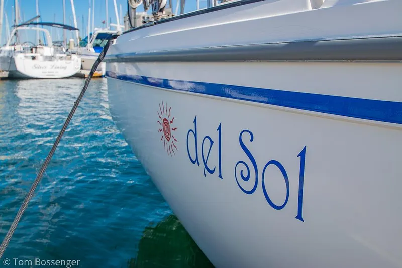 Slide: The Image of Catalina 36 sailboat named "del Sol" docked in a marina, 1987 model. - 4