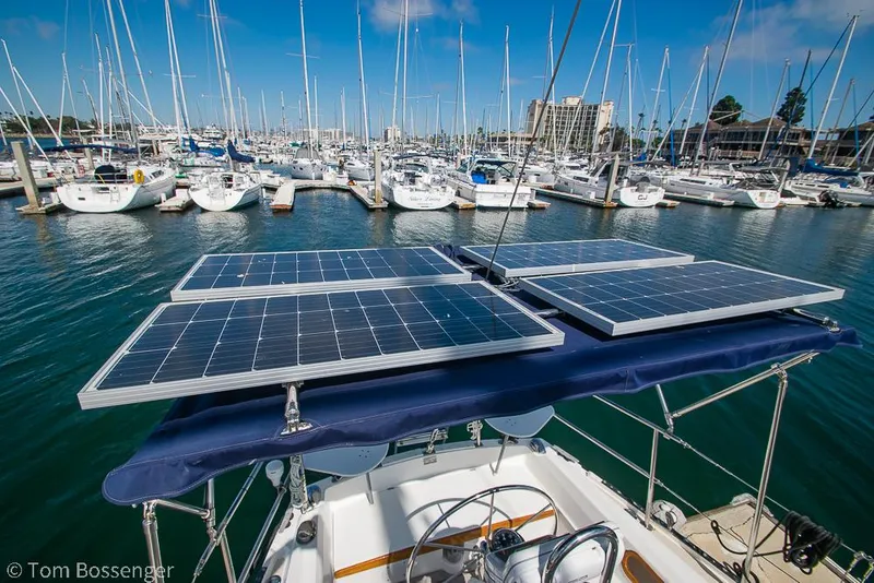Slide: The Image of Sailboat with solar panels docked in a marina, Catalina 36, 1987 model. - 41