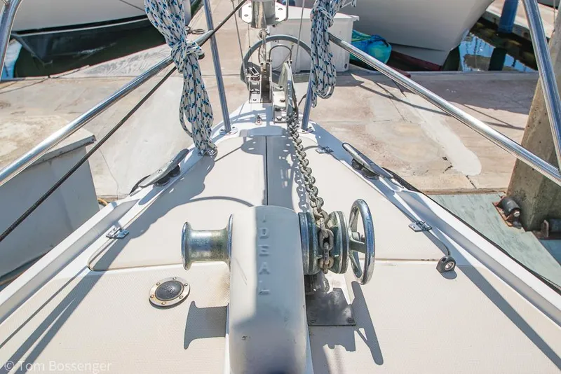Slide: The Image of Bow of 1987 Catalina 36 sailboat with anchor chain and winch. - 44