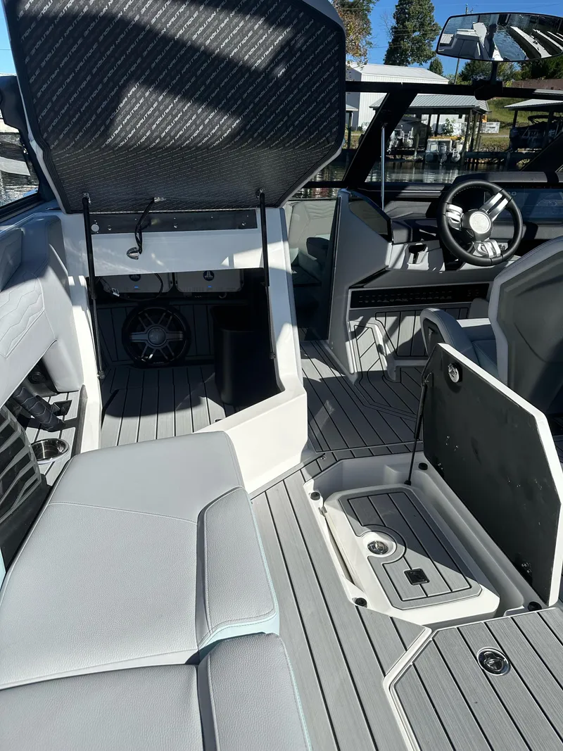 Slide: The Image of 2025 Nautique Super Air Nautique G23 interior with modern seating and sleek design. - 15