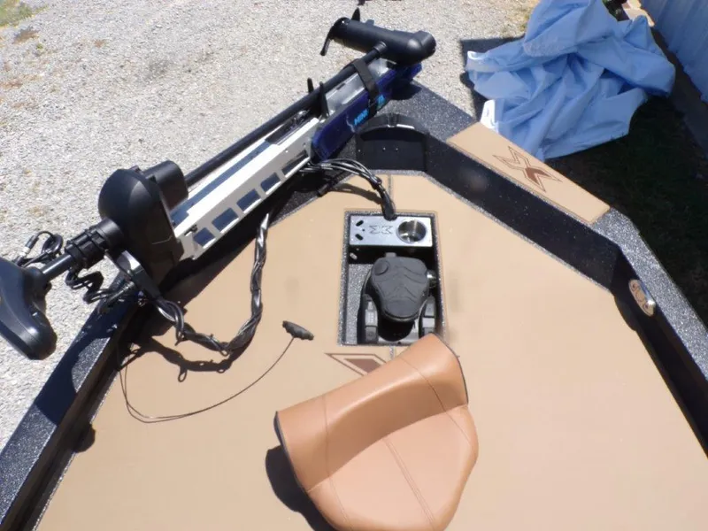 Slide: The Image of 2026 Xpress H20 Bass boat deck with trolling motor and tan seat. - 11
