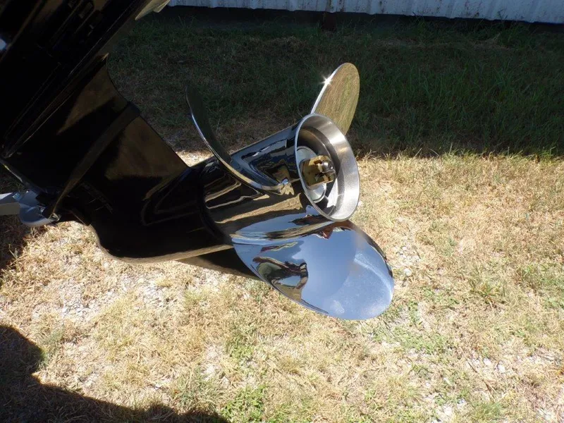 Slide: The Image of 2026 Xpress H20 Bass boat propeller on dry grass background. - 17