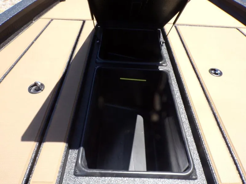 Slide: The Image of Open storage compartment on 2026 Xpress H20 Bass boat deck. - 7
