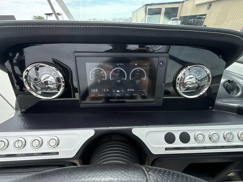 Slide: The Image of Dashboard of 2022 Crownline Eclipse E235 SURF boat with gauges and digital display. - 15