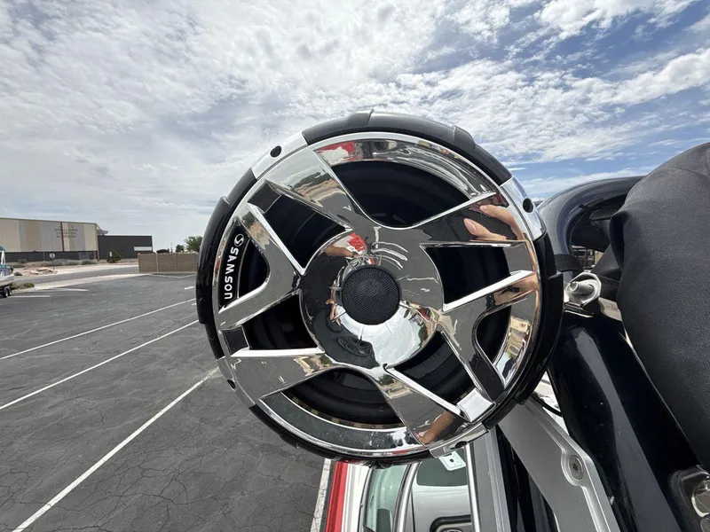 Slide: The Image of Close-up of Samson speaker on 2022 Crownline Eclipse E235 SURF boat, under a cloudy sky. - 21