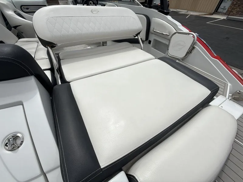 Slide: The Image of 2022 Crownline Eclipse E235 SURF boat interior with white and black seating. - 23