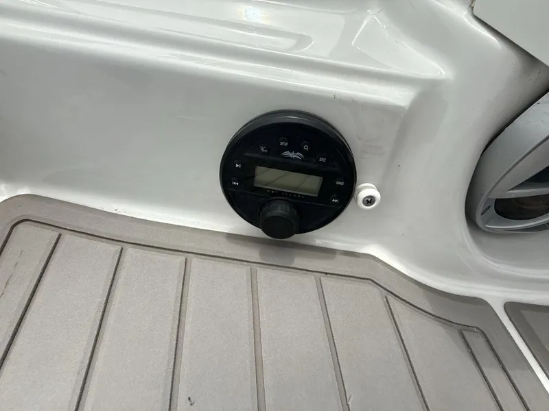 Slide: The Image of Control panel on 2022 Crownline Eclipse E235 SURF boat deck. - 24