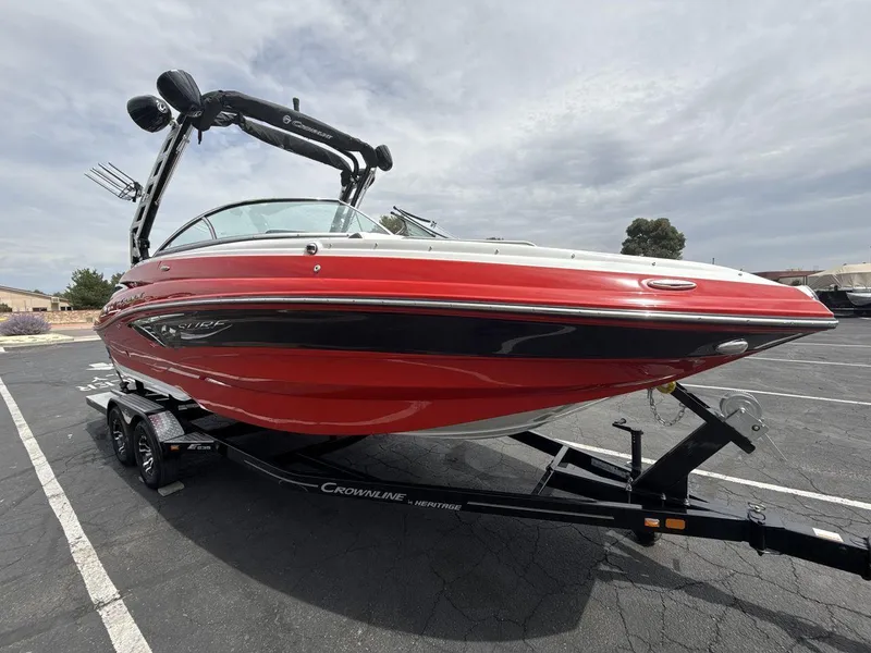 Slide: The Image of 2022 Crownline Eclipse E235 SURF boat on trailer, red and black design. - 7