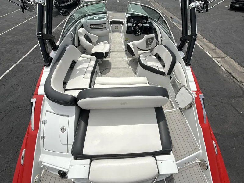 Slide: The Image of 2022 Crownline Eclipse E235 SURF boat interior with spacious seating and modern design. - 9