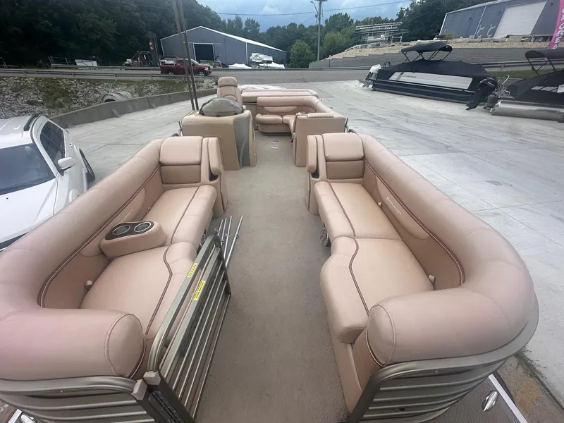 Slide: The Image of 2008 Godfrey Sanpan 2500 RE pontoon boat with beige seating, parked outdoors. - 3