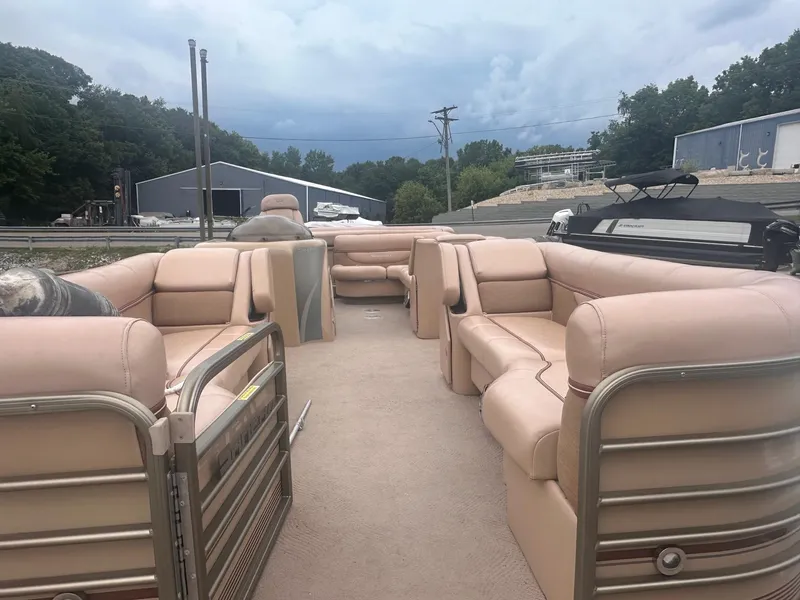 Slide: The Image of 2008 Godfrey Sanpan 2500 RE pontoon boat with spacious seating and beige upholstery. - 5