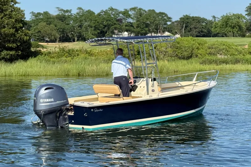 Slide: The Image of 2026 Rossiter 17 boat with Yamaha engine on a calm lake. - 9