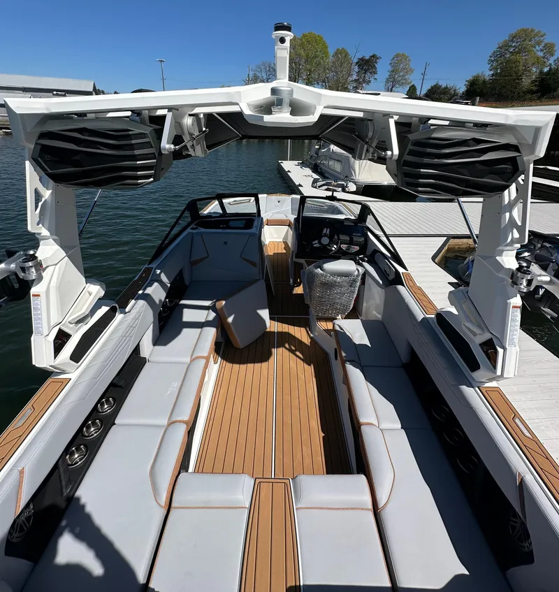 Slide: The Image of 2025 Nautique Super Air Nautique S23 boat interior with sleek seating and modern design. - 12