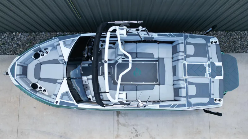 Slide: The Image of 2025 Malibu Wakesetter 23 LSV boat, top view, sleek design, spacious seating, modern features. - 11