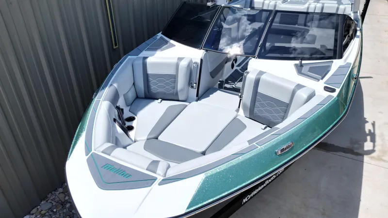 Slide: The Image of 2025 Malibu Wakesetter 23 LSV boat with sleek design and spacious seating. - 12
