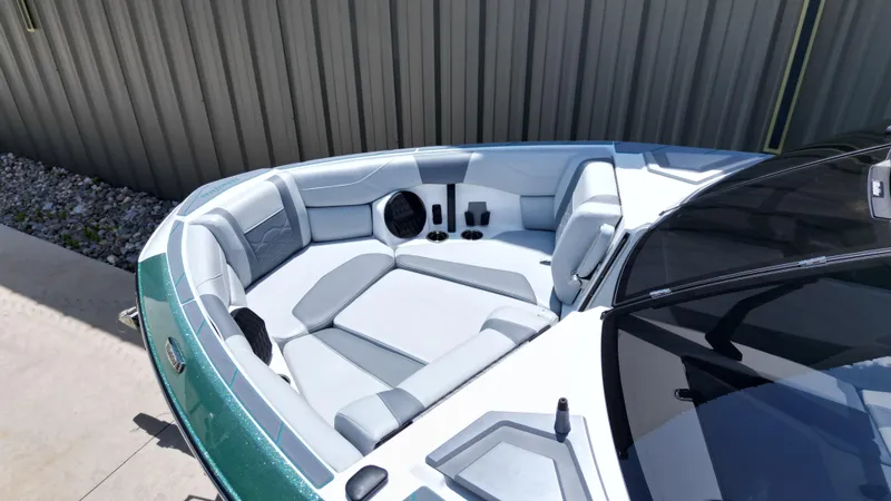 Slide: The Image of 2025 Malibu Wakesetter 23 LSV boat interior with sleek seating and cup holders. - 13