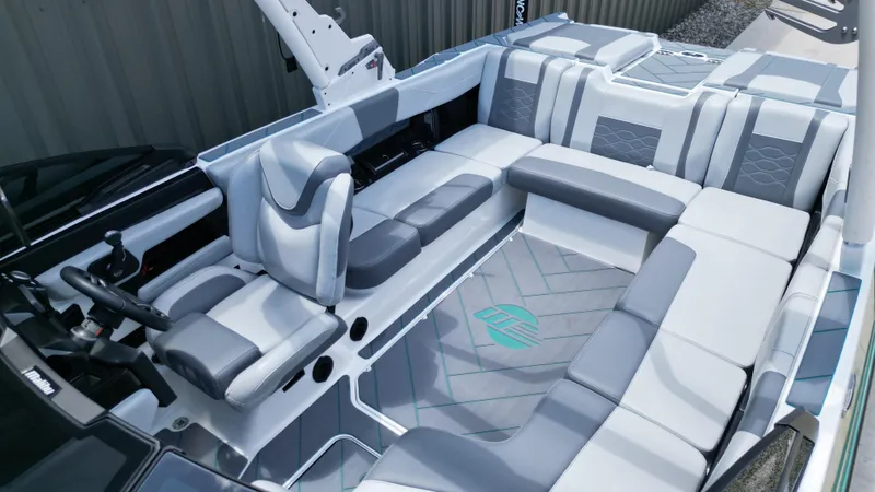 Slide: The Image of 2025 Malibu Wakesetter 23 LSV interior with sleek gray and white seating design. - 14