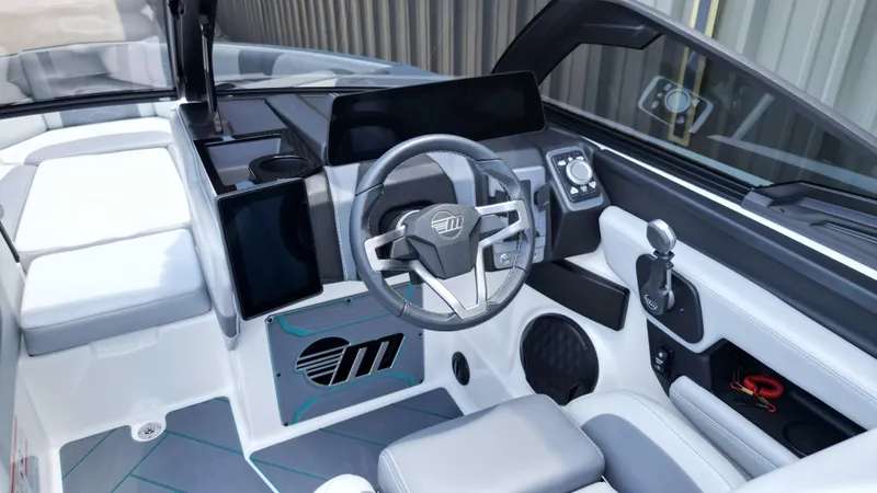 Slide: The Image of 2025 Malibu Wakesetter 23 LSV interior with modern dashboard and steering wheel design. - 16