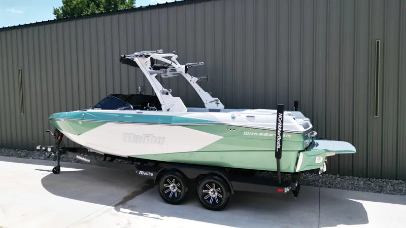 Slide: The Image of 2025 Malibu Wakesetter 23 LSV boat on trailer, parked outdoors. - 4
