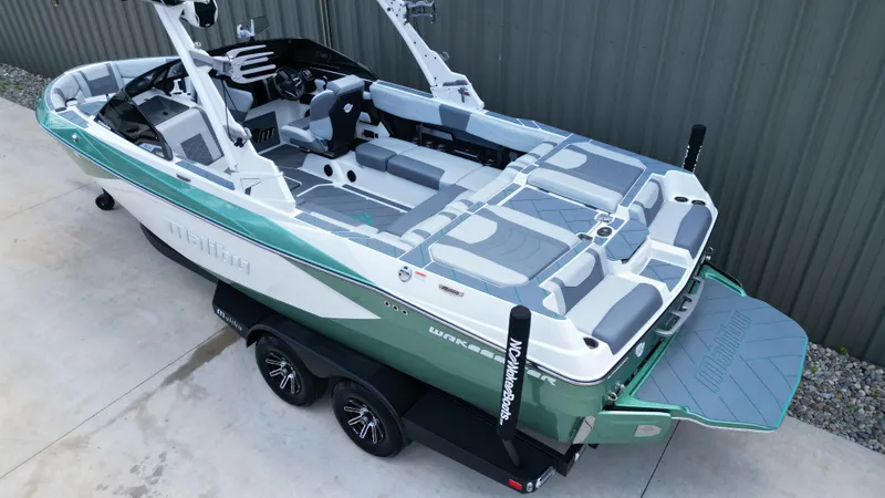 Slide: The Image of 2025 Malibu Wakesetter 23 LSV boat on trailer, featuring sleek design and spacious seating. - 7