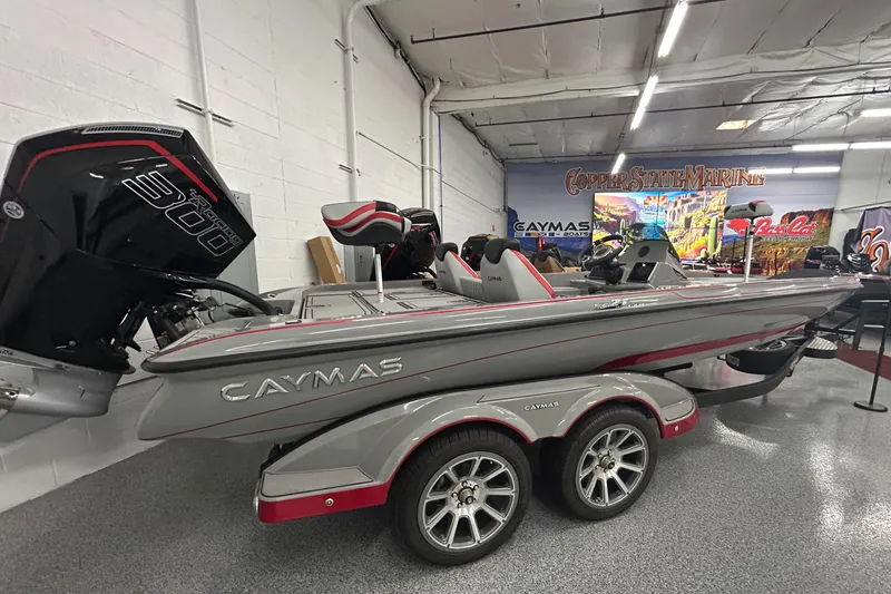 The Image of 2025 Caymas XS 21 Pro boat in showroom, featuring sleek design and powerful engine. - 1