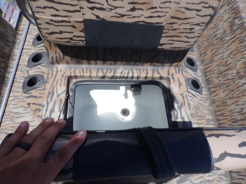 Slide: The Image of 2026 Xpress XP18CC boat interior with camouflage design and livewell compartment. - 4