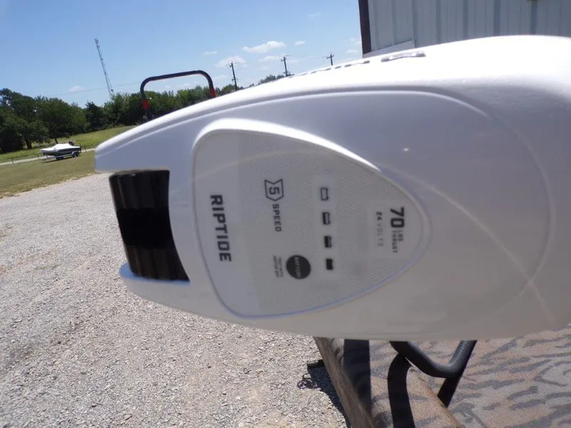 Slide: The Image of Riptide motor on Xpress XP18CC boat, 2026 model, in outdoor setting. - 8