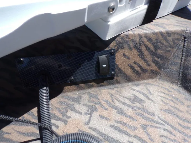 Slide: The Image of 2026 Xpress XP18CC boat interior with trim switch and camo pattern. - 9