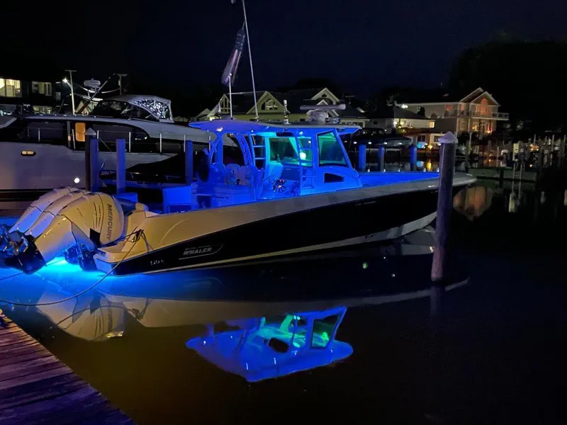Slide: The Image of 2014 Boston Whaler 370 Outrage boat in a workshop, side view. - 10